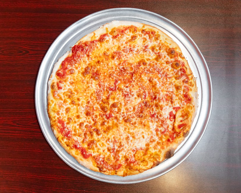 A classic cheese pizza with melted mozzarella and red sauce on a metal tray.